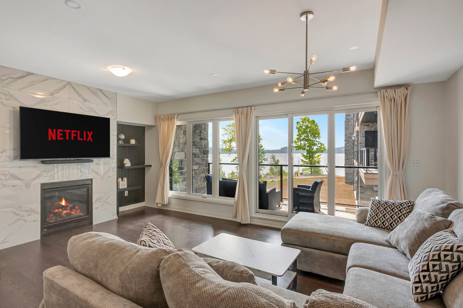 Fairy Lake 2 Bed 2.5 Bath Condo with private beach access in Huntsville — living room with lake view